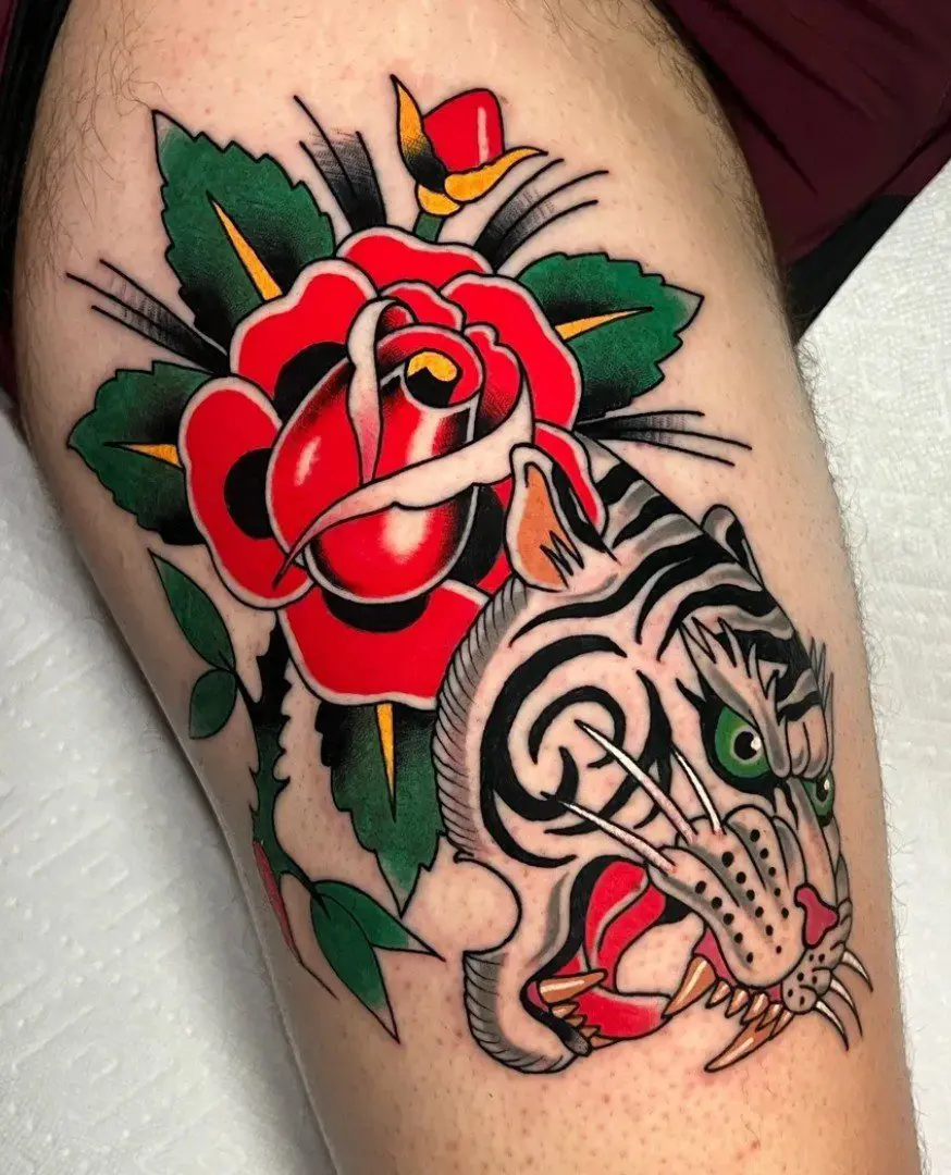 A tattoo of a tiger and roses made by Myke Chambers