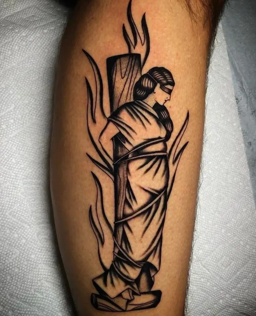 A tattoo of a man being burned at the stake
