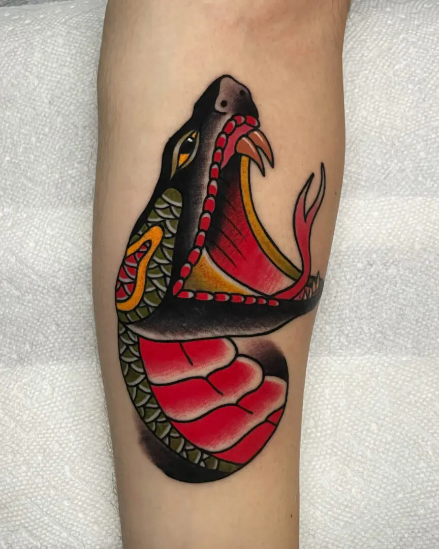 Traditional Snake head tattoo made by Best American Traditional Tattoo Artist - Myke Chambers