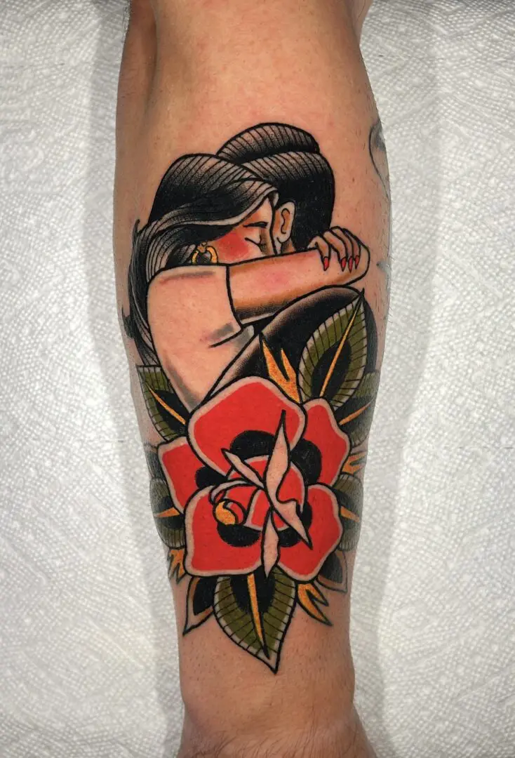 Tattoo of a Man and Women kissing. Best American Traditional Tattoo Artist - Myke Chambers