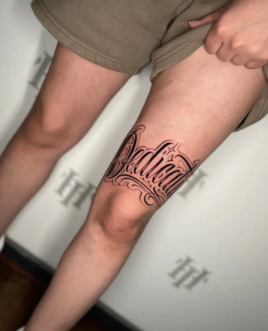 Lettering tattoo on thigh made by Sebastian Rivera