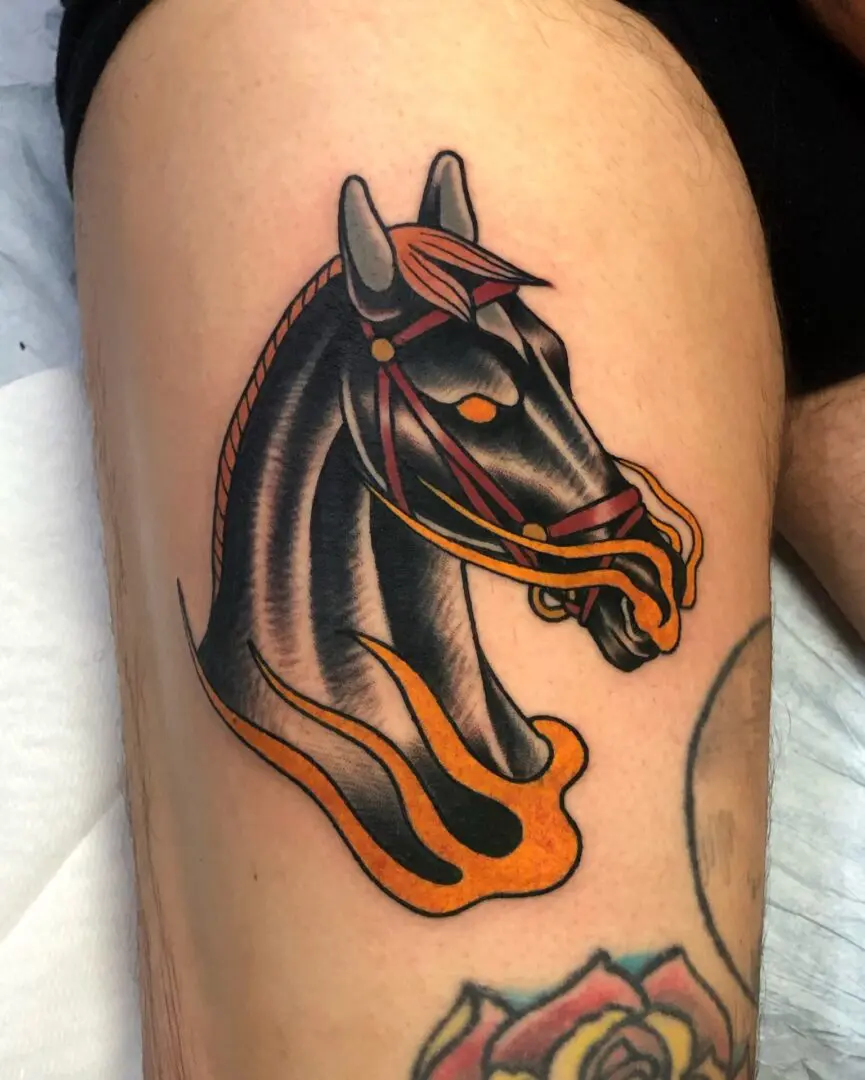A horse with flames on it's head and arm. Best American Traditional Tattoo Artist - Myke Chambers