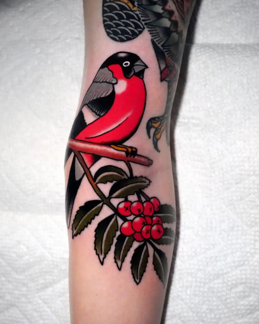 A tattoo of a bird on a branch. Best American Traditional Tattoo Artist- Myke Chambers