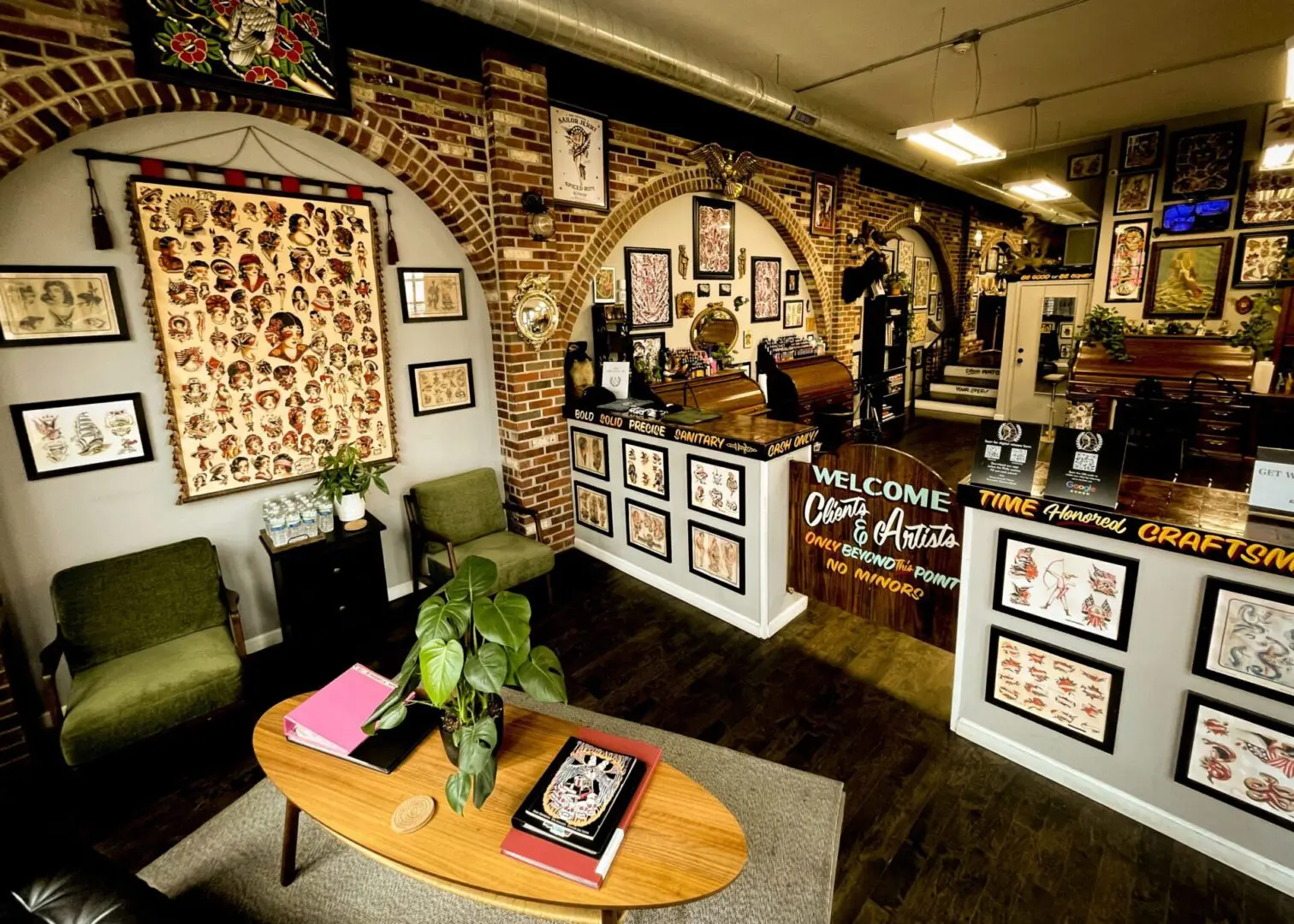 Lobby of Philadelphia tattoo shop with tattoo flash hung on the walls