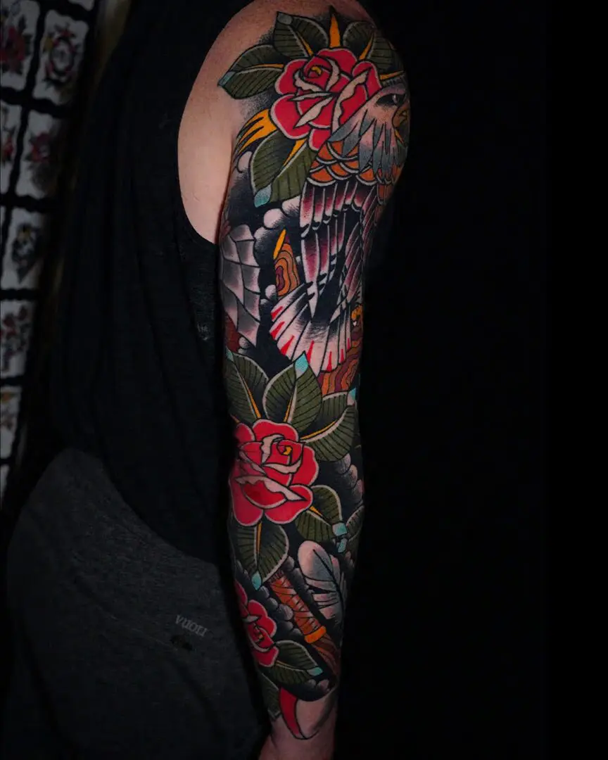 A person with a tattoo on their arm. Best American Traditional Tattoo Artist- Myke Chambers
