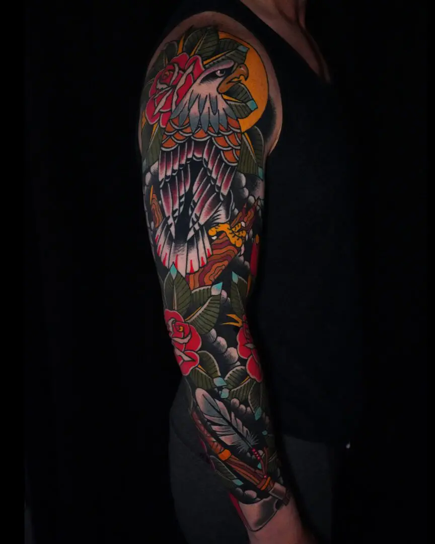 A man with a tattoo on his arm. Best American Traditional Tattoo Artist- Myke Chambers