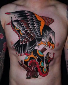 A tattoo of an eagle and snake chest piece. Best American Traditional Tattoo Artist- Myke Chambers