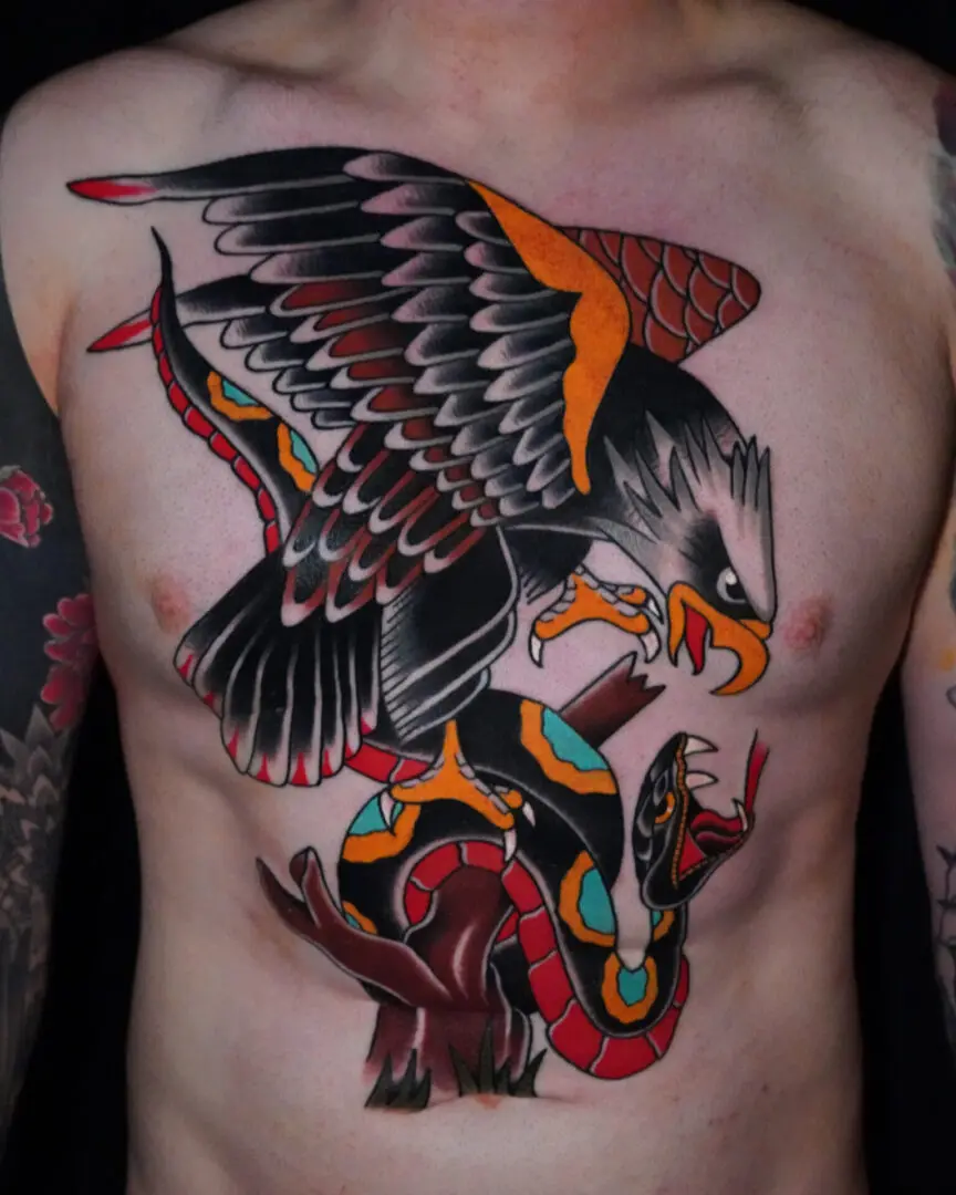 A tattoo of an eagle and snake chest piece. Best American Traditional Tattoo Artist- Myke Chambers