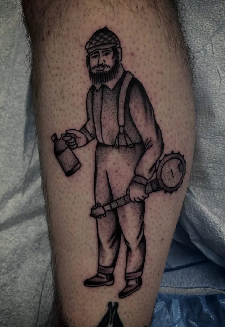 A black and white tattoo by an Asheville tattoo artist of a man holding a can.
