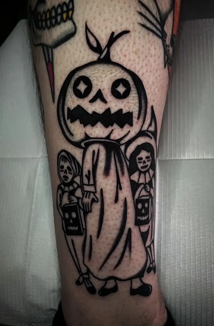 A black and white tattoo of a jack o lantern by an Asheville tattoo artist.