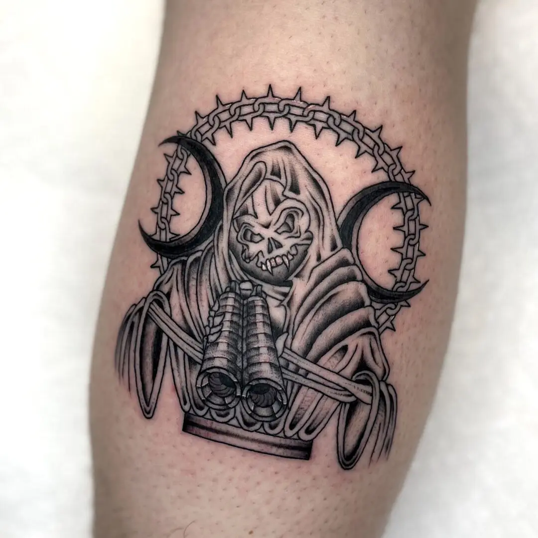 A black and gray traditional tattoo of a skeleton holding a book.