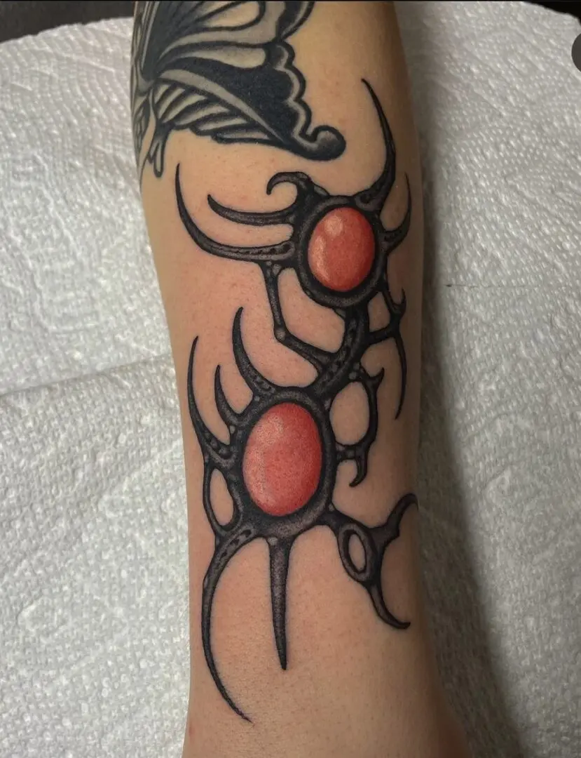 fine line orb tattoo with red orbs
