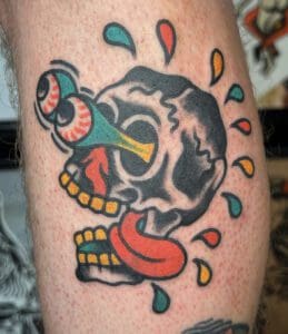 skull tattooed rendered in american traditonal