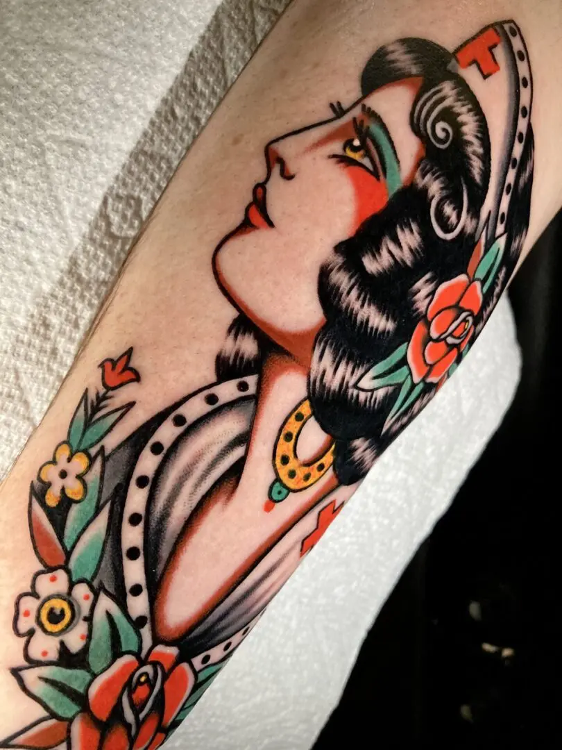 traditional tattoo of a nurse rendered in color
