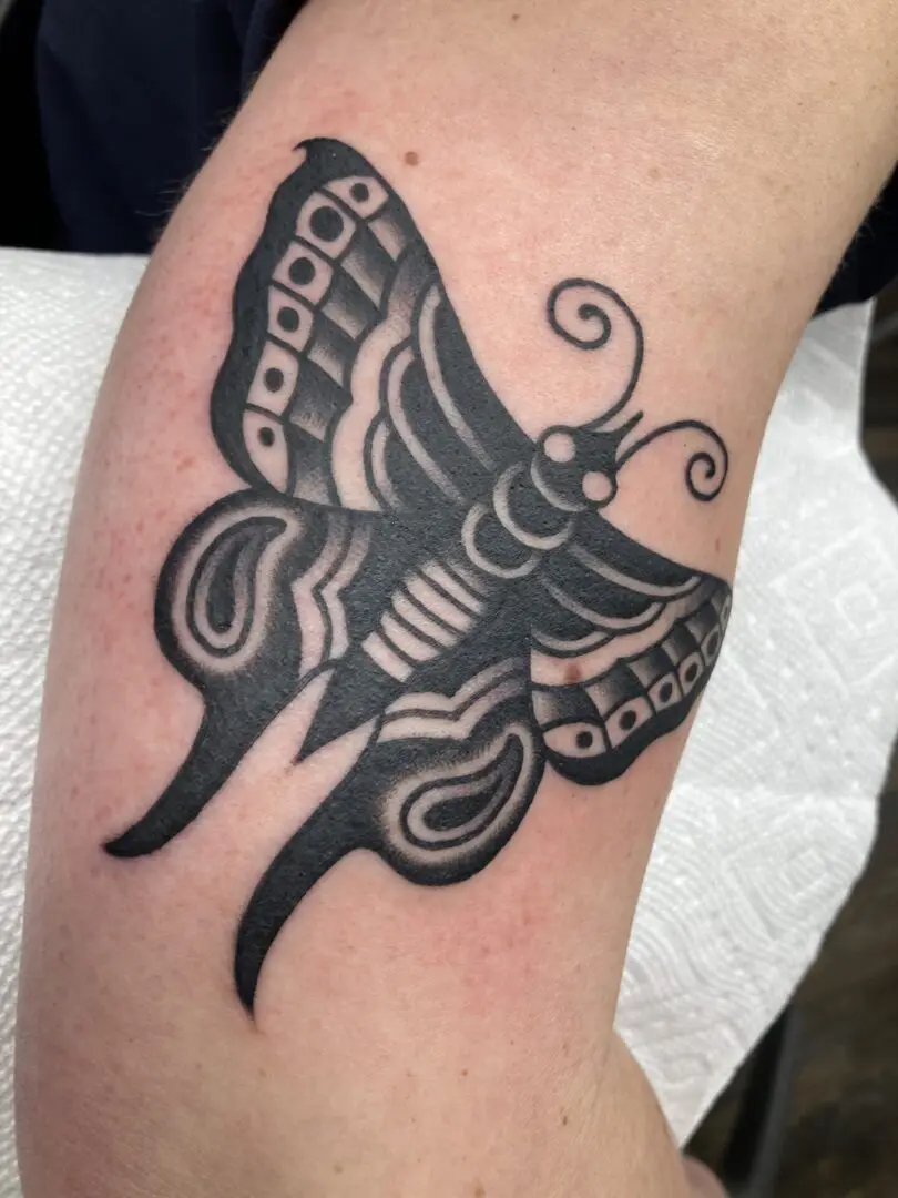 black and gray american tradtional butterfly tattoo