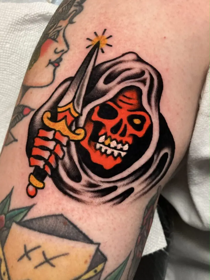 a tattoo of a reaper