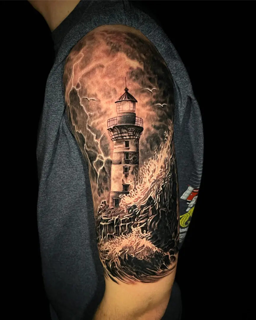 Lighthouse realism tattooing black and grey