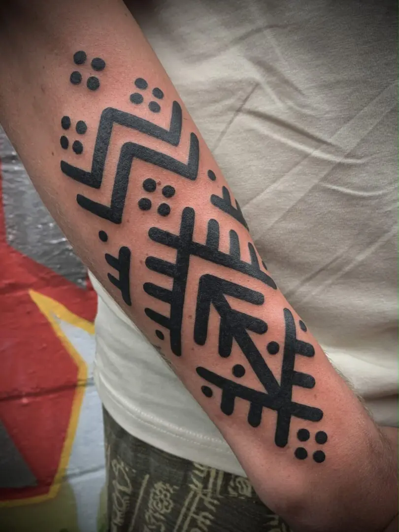 Bold tribal blackwork tattoo