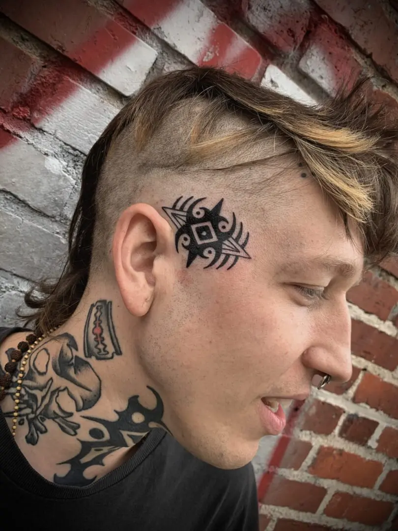 tribal tattoo on head