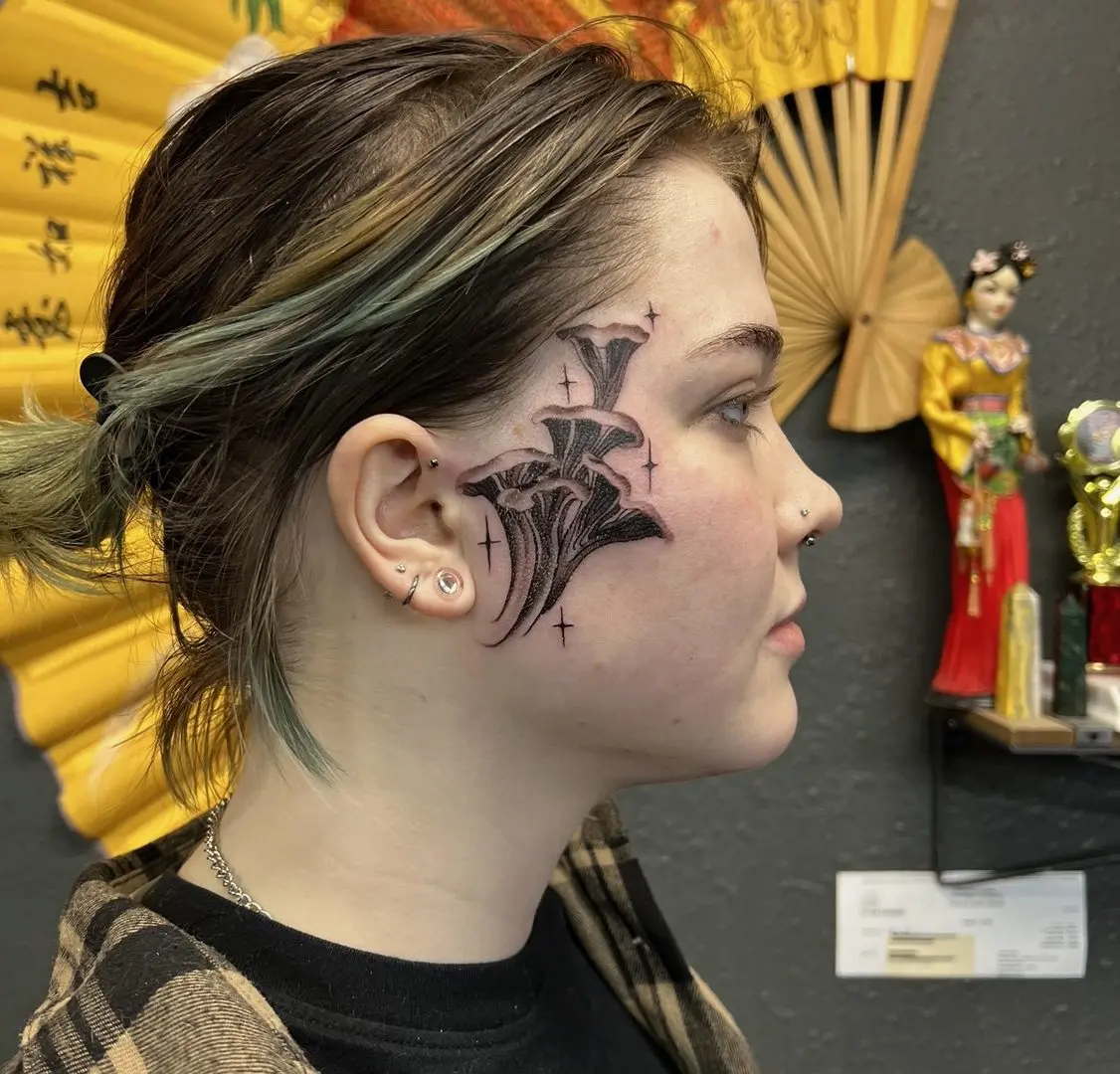 japanese ave tattoo on face