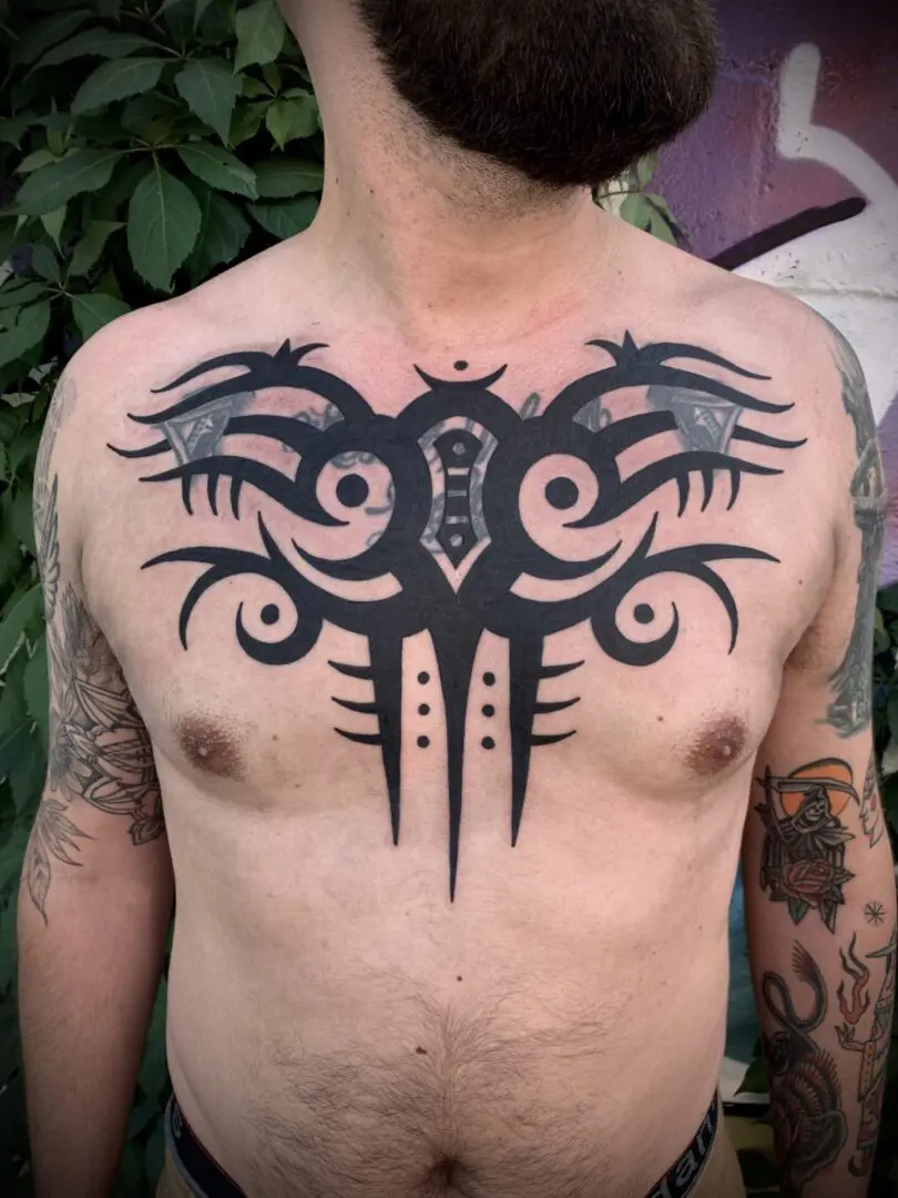 tribal chest piece tattoo
