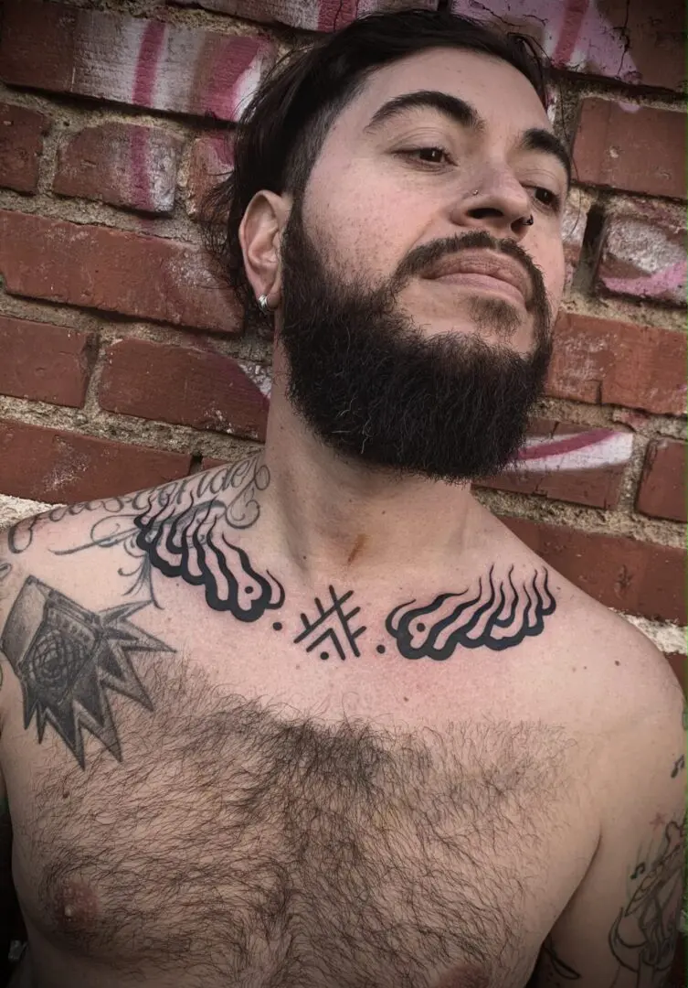 tribal flames tattoo on neck