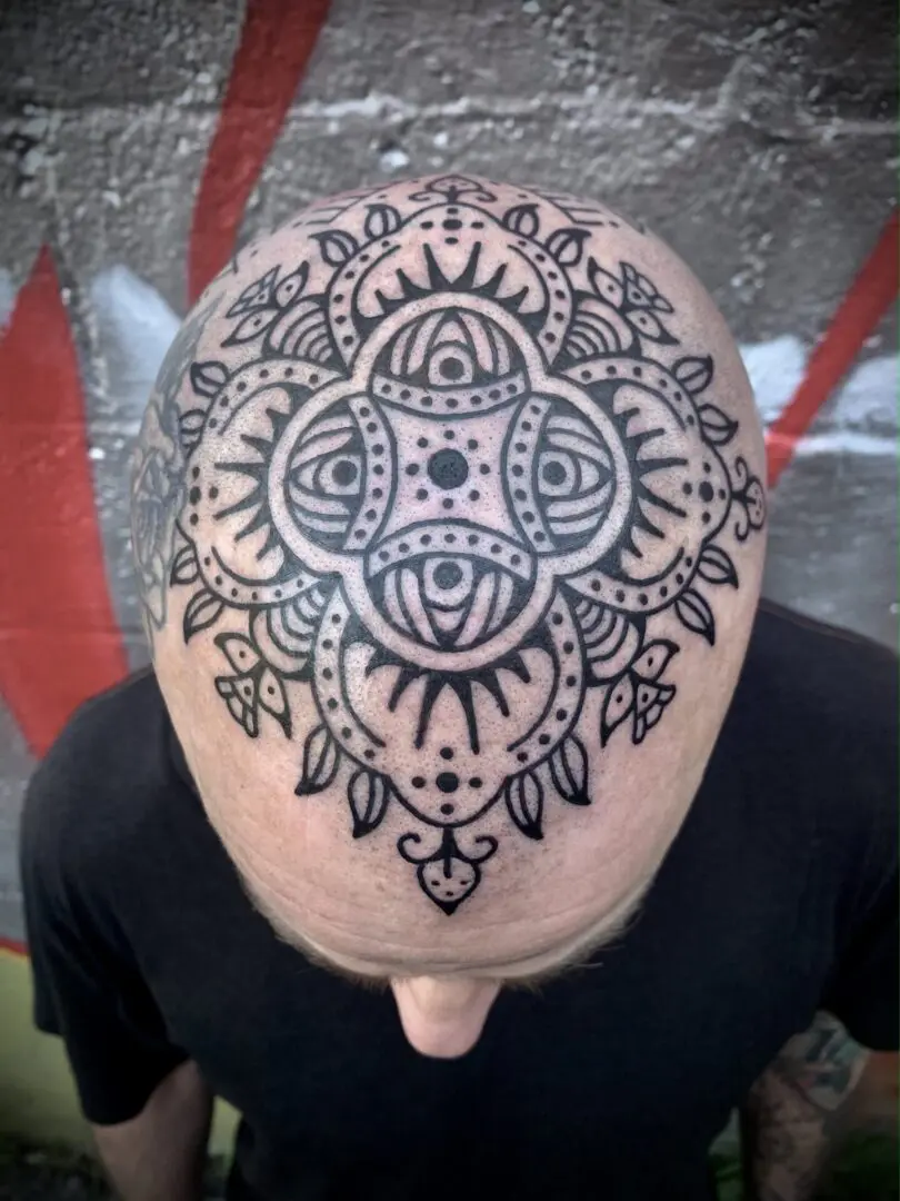Geometric decorative blackwork tattoo